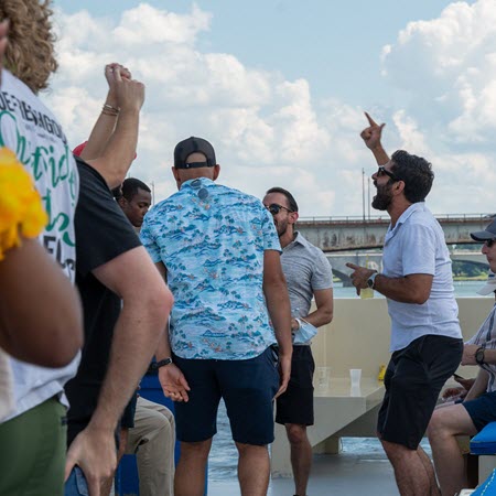 People Celebrating On Open-Air Rooftop Boat Cruise